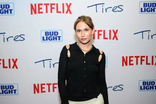 Veronika Slowikowska wearing a black cardigan, smiling ahead.