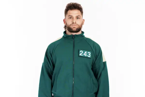 Squid Game: The Challenge player Stephen wearing a green tracksuit with 243 on his chest