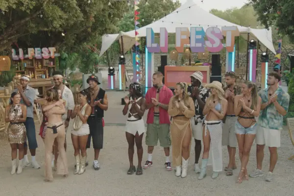 The cast of Love Island stood in their couples, one in front of the other, all smiling and clapping as Toni and Yasmin hug.