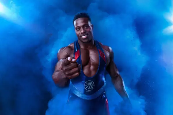 Nitro with his finger pointing outwards. He is surrounded by blue smoke