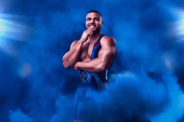 Steel for the Gladiators. He is surrounded by blue smoke