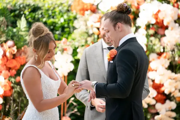 Married at First Sight Australia season 11 bride Eden putting the wedding band on her husband Jayden.