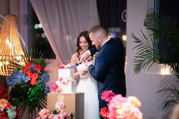 Married at First Sight Australia season 11 couple Ellie and Ben cutting the cake on their wedding day.