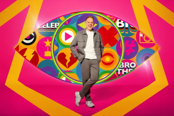 Celebrity Big Brother contestant Colson Smith posing in front of the iconic Big Brother eye.