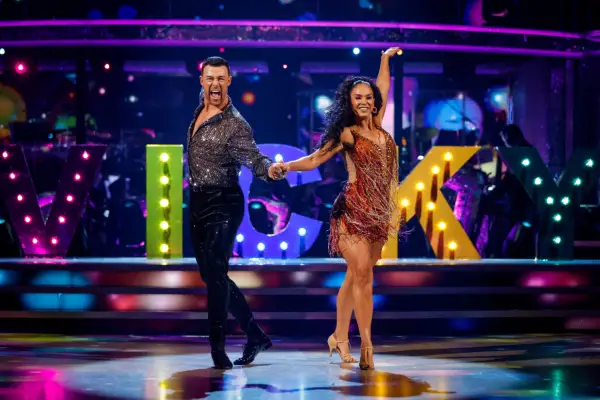 Kai Widdrington and Vicky Pattison with their hands stretched out in the air as they danced.