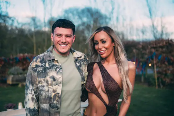 Ella and JJ pictured for Married at First Sight UK, smiling at the camera