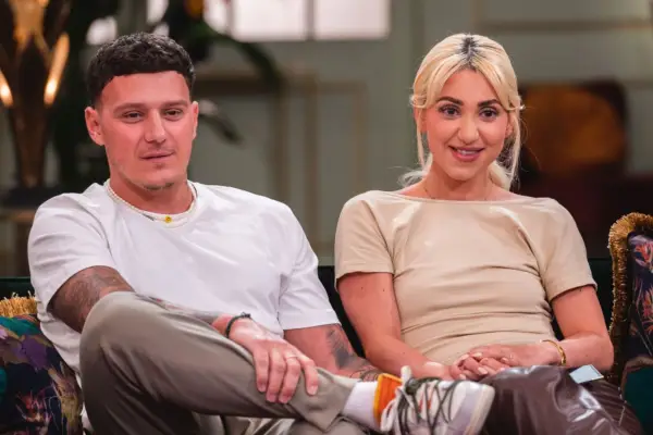 MAFS UK couple JJ and Bianca sitting together on a sofa