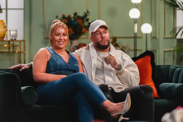 Sacha and Ross on Married at First Sight UK, sat on a sofa together