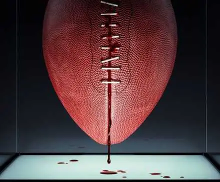 Blood dripping off a pigskin football on the poster for Him.