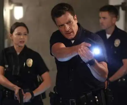 Nolan takes the lead with his gun out, with Bradford and Chen behind him