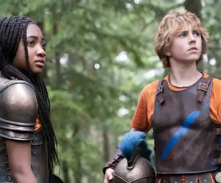 Walker Scobell and Leah Sava Jeffries wearing battle armor in Percy Jackson and the Olympians.
