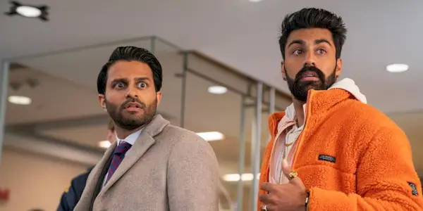 Mir and Raj looking surprised as the FBI raid their father