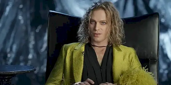 A promo photo of Sam Reid as Lestat de Lioncourt in a yellow jacket in Interview with the Vampire Season 3.
