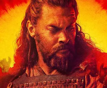 Jason Momoa looking to the side in an orange and red poster for See