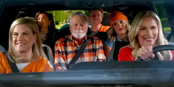 Leanne Morgan as Leanne driving a car with Kristen Johnston as Carol and their family in Netflix