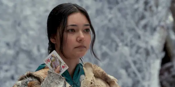 Mari holding up the Queen of Hearts in the Yellowjackets Season 3 finale