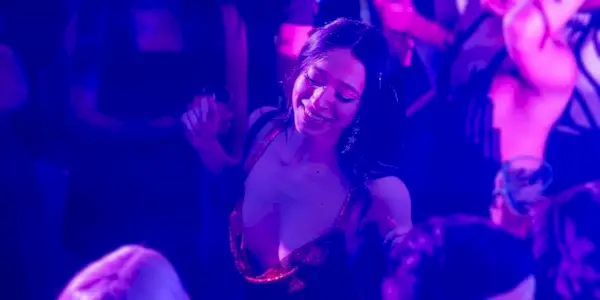 Mikey Madison as Ani dancing at a party in Anora. 