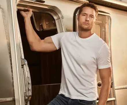 Justin Hartley as Colter Shaw holding onto the doorway of his trailer in Season 1 of CBS