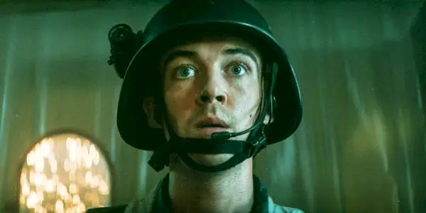 Samuel Blenkin wears a helmet with a mic in Alien Earth