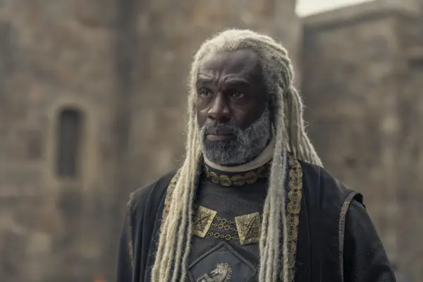Steve Toussaint as Lord Corlys Velaryon wearing robes and sporting white dreadlocks in House of the Dragon season 2.