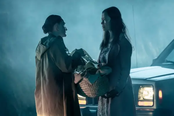 Beth Grant and Erica Gimpel in Mayfair Witches standing by a car