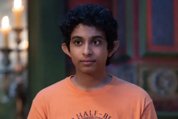 Grover Underwood wearing an orange T-shirt in Percy Jackson and the Olympians