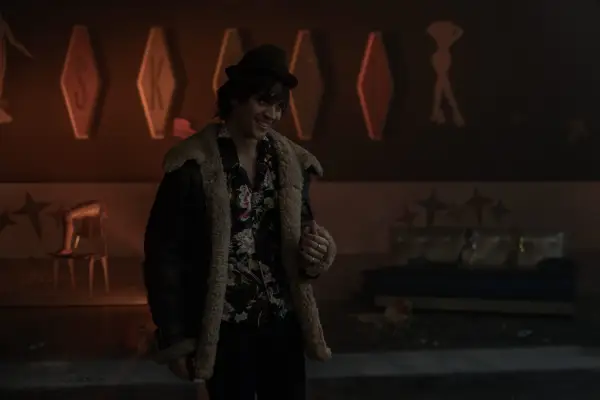 David Iacono as David the Demon in Dead Boy Detectives in a fluffy coat and hat