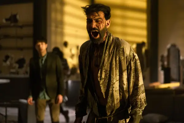 Rahul Kohli as Napoleon Usher in The Fall of the House of Usher screaming, wearing a kimono