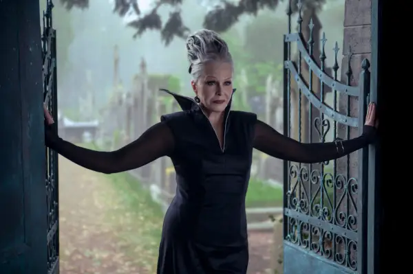 Joanna Lumley in beehive hairdo and black gothic dress