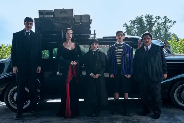 Joonas Suotamo as Lurch, Catherine Zeta-Jones as Morticia Addams, Jenna Ortega as Wednesday, Isaac Ordonez as Pugsley Addams, Thing, Luis Guzmán as Gomez Addams in Wednesday season 2