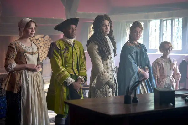Bo Bragason as Roxy Trotter, Ényì Okoronkwo as Rasselas, Frank Dillane as Charles Devereux, Louisa Harland as Nell Jackson and Florence Keen as George Trotter in Renegade Nell. They are all wearing period dress and are stood in a line
