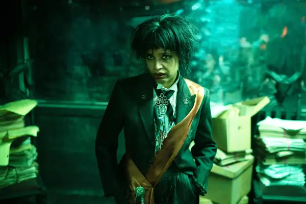 Shelley Conn as Beelzebub in Good Omens season 2, wearing a black suit