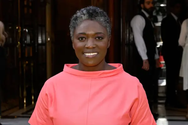 Andi Osho wearing a red dress