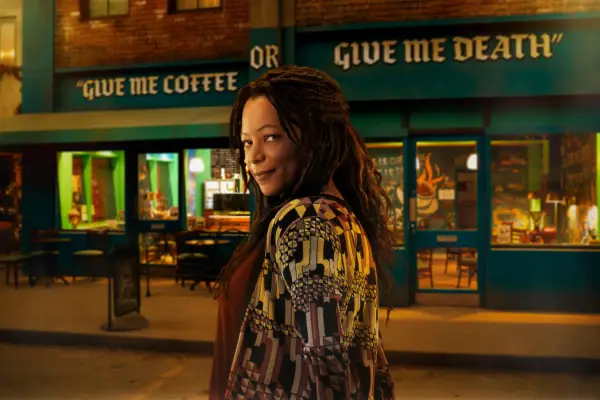 Nina Sosanya as Nina in Good Omens season 2, looking into camera