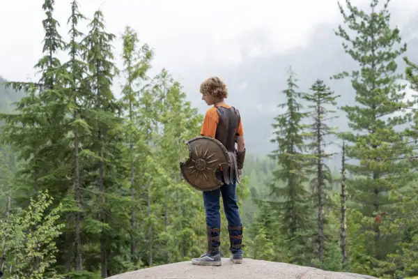 Walker Scobell as Percy Jackson, Leah Sava Jeffries as Annabeth Chase and Aryan Simhadri as Grover Underwood in Percy Jackson and the Olympians standing, looking resolute