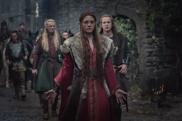 Mecia Simson in The Witcher, with her arms outstretched