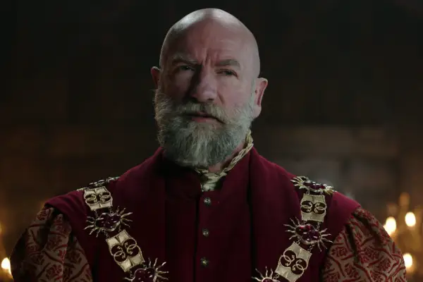 Graham McTavish in The Witcher, wearing a red outfit