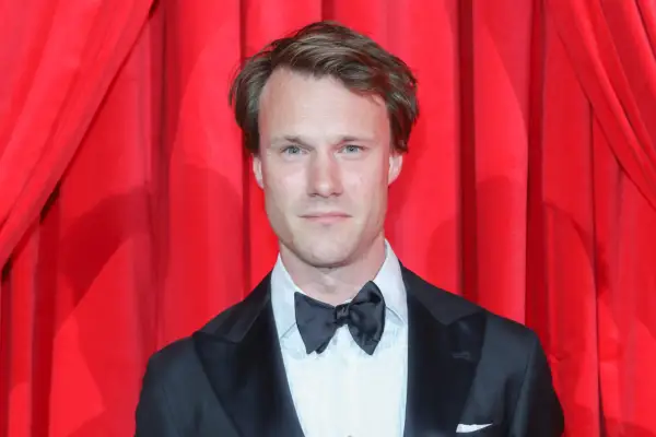 Hugh Skinner in a tuxedo