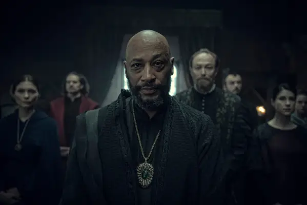 Terence Maynard in The Witcher, standing in front of Stregobor