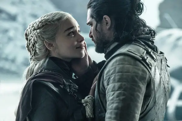 Daenerys Targaryen and Jon Snow in Game of Thrones season 8, standing close to one another looking at each other