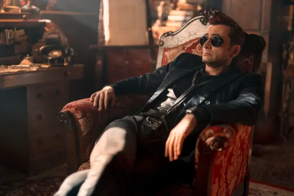 David Tennant as Crowley in Good Omens season 2, sitting in a chair