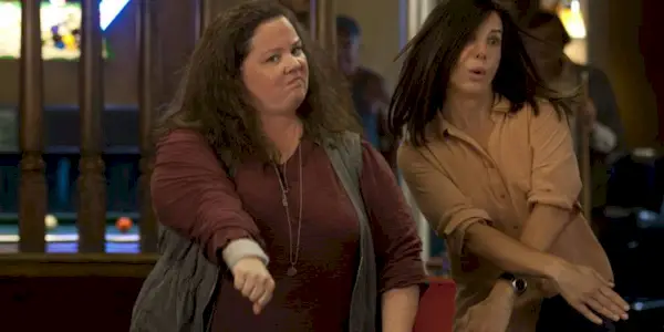 Melissa McCarthy and Sandra Bullock as Shannon and Sarah dancing in The Heat