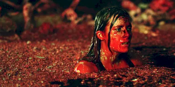Shauna Macdonald swimming in an horrifying pool of red fluid in The Descent.