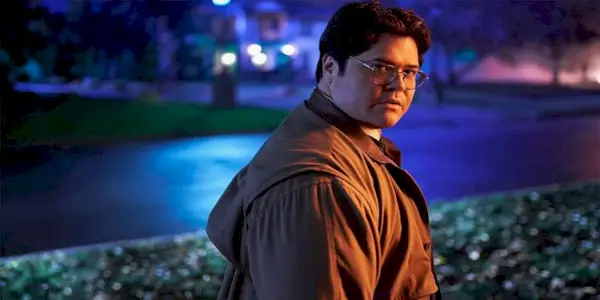 Guillermo (Harvey Guillén) standing in the dark looking back at the camera in What We Do in the Shadows Season 2, Episode 4, 