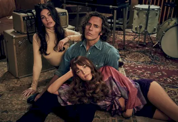 Riley Keough as Daisy Jones, Sam Claflin as Billy Dunne, and Camila Morrone as Camila Dunne in Daisy Jones & The Six