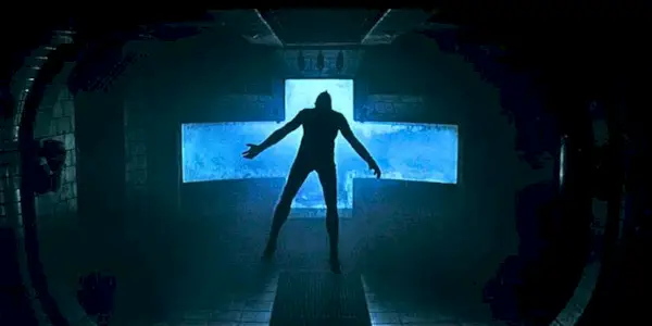 A lifeless body floats inside a dimly lit spaceship in Event Horizon.