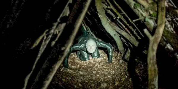 The shapeshifting forest monster wearing Charles Aitken