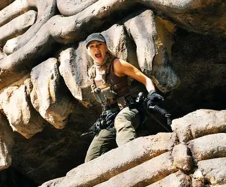 Scarlett Johansson as Zora Bennett, standing at the mouth of a cave and shouting in Jurassic World Rebirth