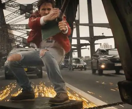 Ryan Gosling sliding on a piece of metal in The Fall Guy