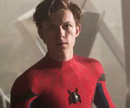 Tom Holland as Spider-Man with his mask off looking angry in Spider-Man: Homecoming.